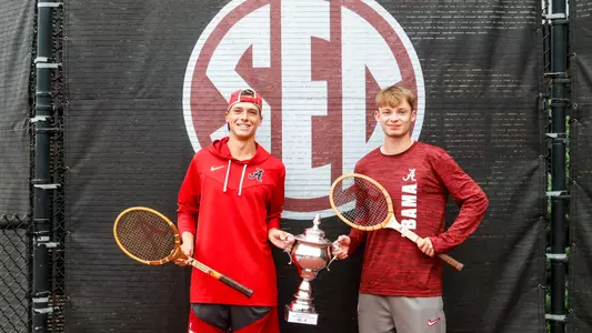 Roan Jones and Andrii Zimnokh standing with trophy