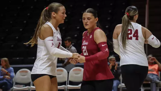 Francesca Bertucci (21) and Lindsey Brown (8) high five during a match vs. Tennessee (Sept. 25, 2024)