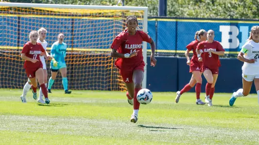 Gianna Paul dribbles the ball