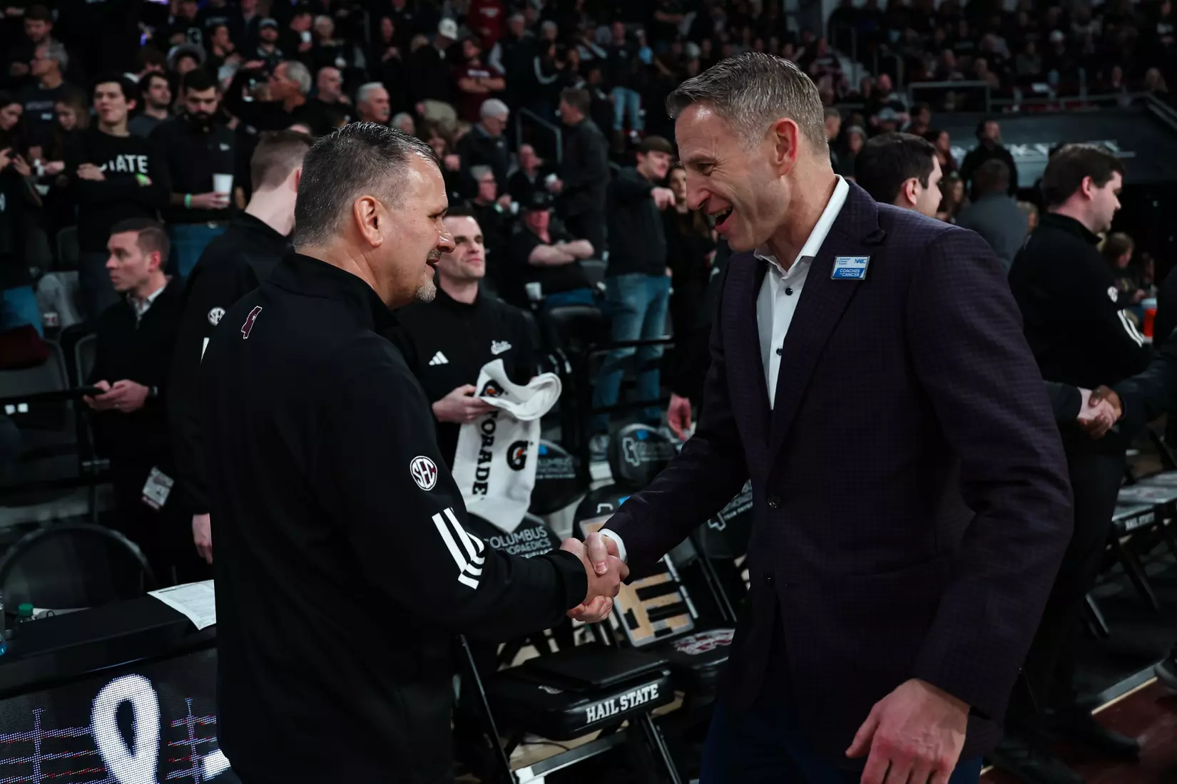 Alabama basketball coach Nate Oats exchanged a handshake with Mississippi State Coach Chris Jans during pregame at Humphrey Coliseum in Starkville, Mississippi, on Wednesday, January 29, 2025.
