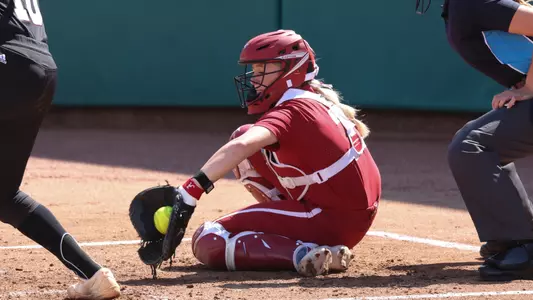Alabama Softball Player Holly Beth Brooks (7) catching behind home plate during Alabama vs MSU game.