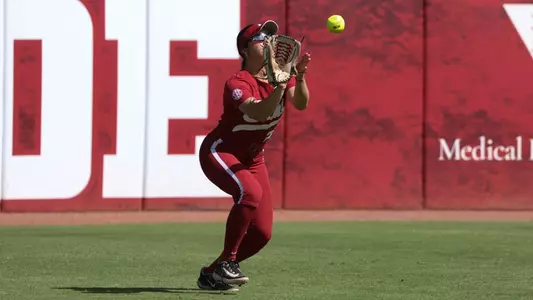 Alabama Softball Player Ana Roman (21) catching a ball in the outfield during Alabama vs MSU game.