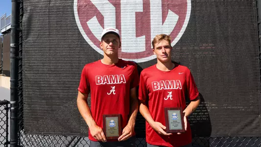 Olar and Zimnokh standing with runner-up trophy