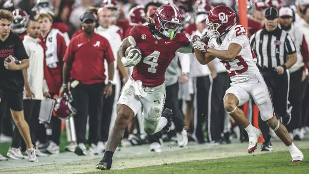 Daniel Hill running the ball against Oklahoma
