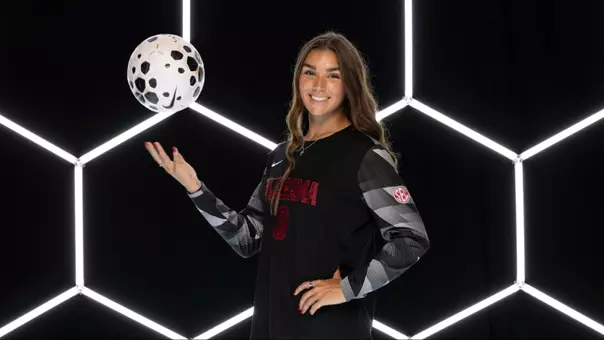 Madi Munguia on creative background with ball