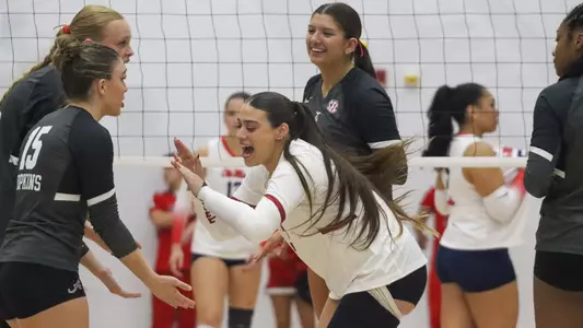 Trinity Stanger (3) high fives Lily Hopkins (15) pregame vs. Ole Miss (Oct. 31, 2025)