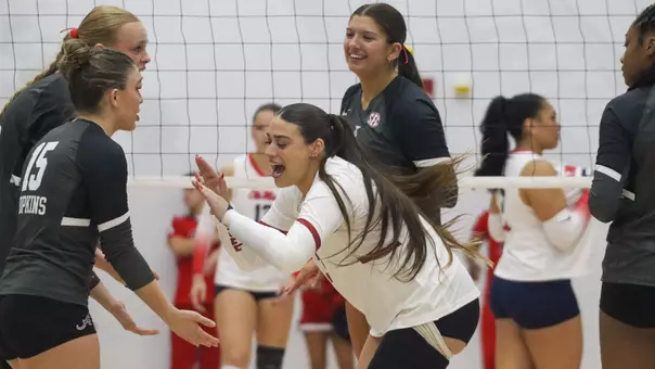 Trinity Stanger (3) high fives Lily Hopkins (15) pregame vs. Ole Miss (Oct. 31, 2025)
