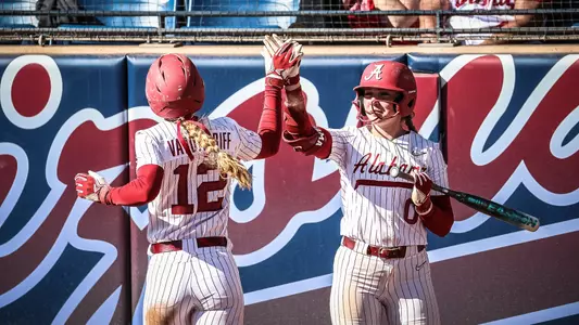 Audrey Vandagriff (12) and Brooke Ellestad (0) high five during a game vs. Western Michigan (Feb. 9, 2025)