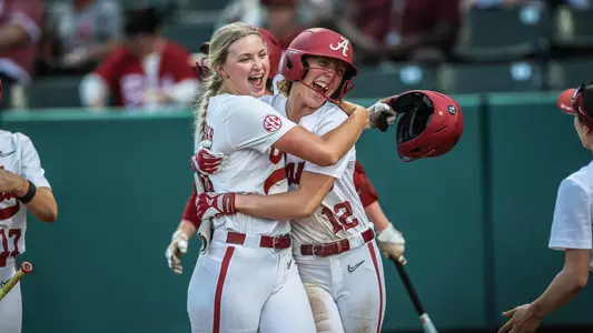 Abby Duchscherer (10) and Audrey Vandagriff (12) hug after a Duchscherer home run vs. Mississippi State (March 14, 2025)