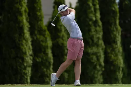 Jones Free tees off during a practice round at North River CC