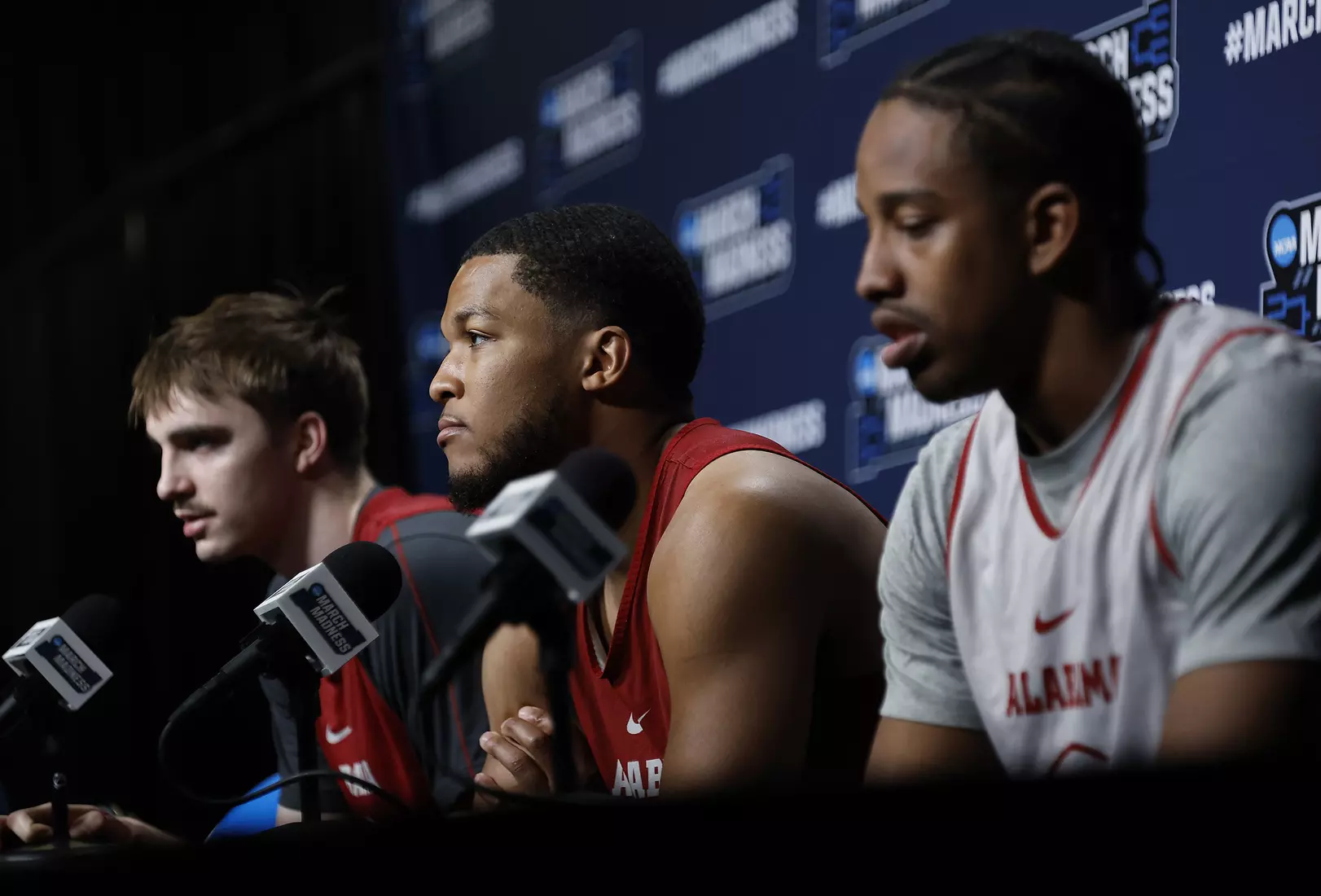 Alabama forward Grant Nelson (4), guard Chris Youngblood (8) and forward Derrion Reid (35) speak to the media at Rocket Arena in Cleveland, OH on Saturday, Mar 22, 2025.