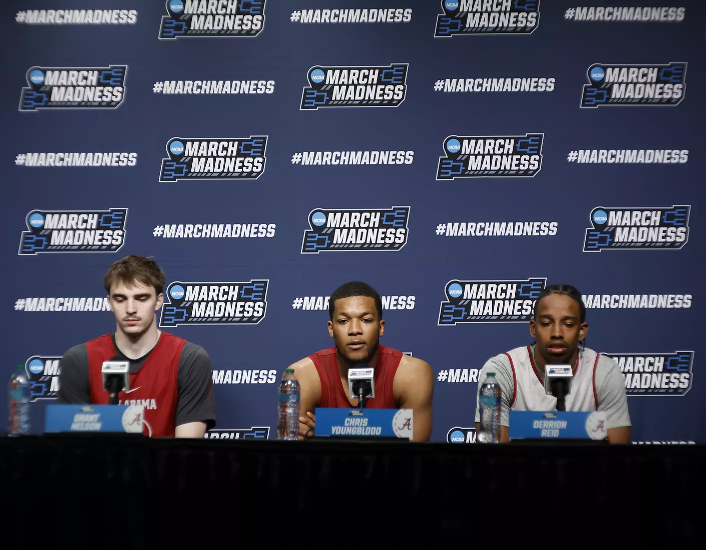 Alabama forward Grant Nelson (4), guard Chris Youngblood (8) and forward Derrion Reid (35) speak to the media at Rocket Arena in Cleveland, OH on Saturday, Mar 22, 2025.