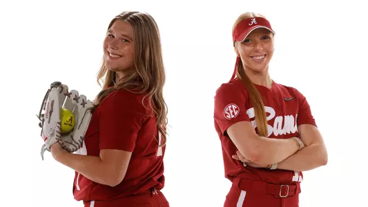 Alabama softball players Catelyn Riley (7) and Audrey Vandagriff (12)