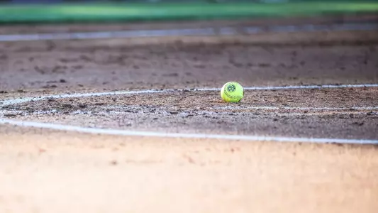 Detail photo of a softball laying in the circle (April 18, 2025)