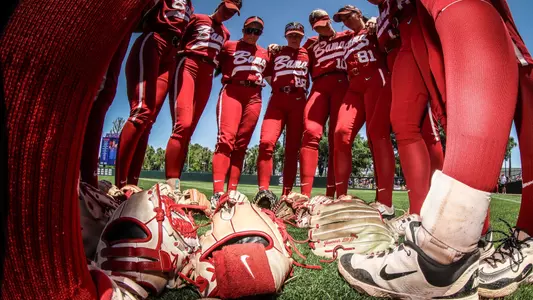 Low angle shot of Alabama softball players in a pregame huddle (April 19, 2025)