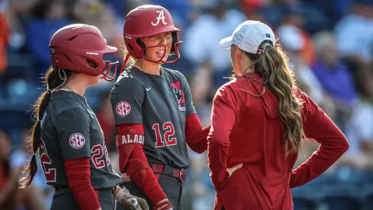 Audrey Vandagriff (12) talks with assistant coach Kayla Braud (April 18, 2025)