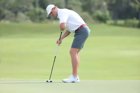 Connor Brown lines up his putt at the SEC Men's Golf Championships