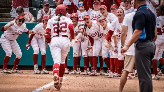 Kali Heivilin (22) heads to home plate as her teammates await her following a home run vs. Virginia Tech (May 17, 2025)