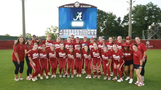 Alabama softball team poses on the field after winning NCAA Regionals (May 18, 2025)