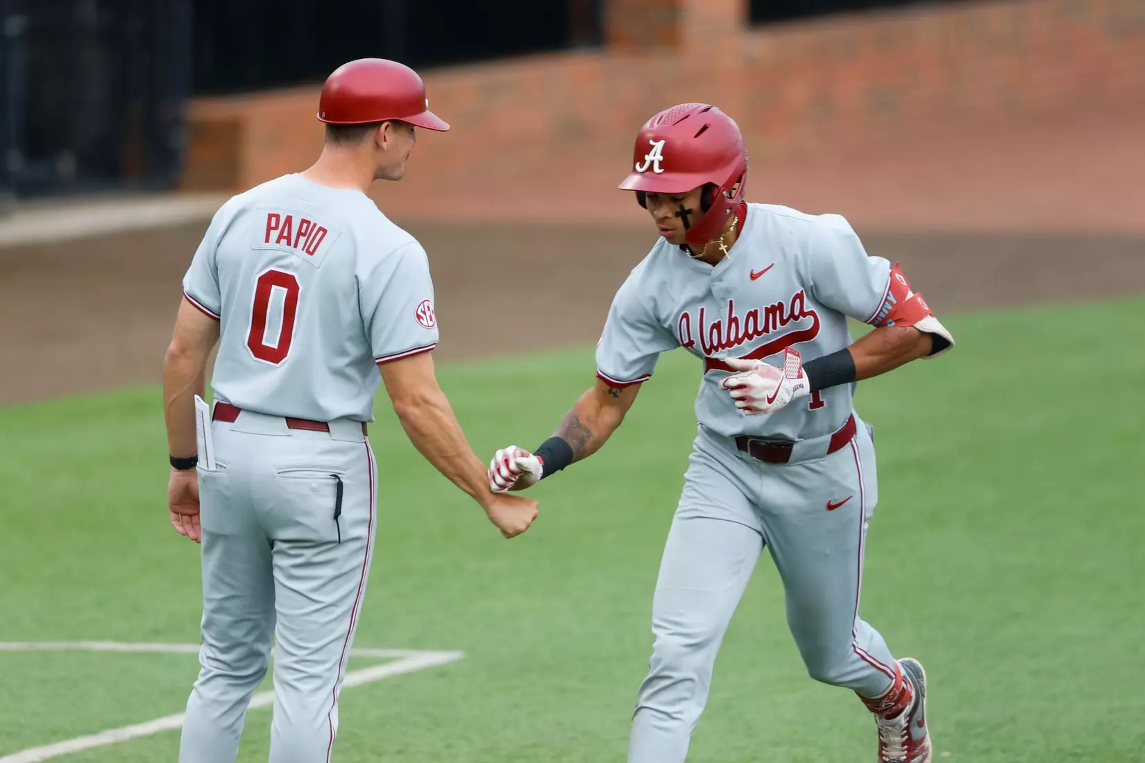 Alabama Assistant Coach Anthony Papio and Alabama Baseball Player Justin Lebron (1) celebrate against Troy at Riddle-Pace Field in Troy, AL on Tuesday, May 6, 2025.
Photo by Robert Sutton
