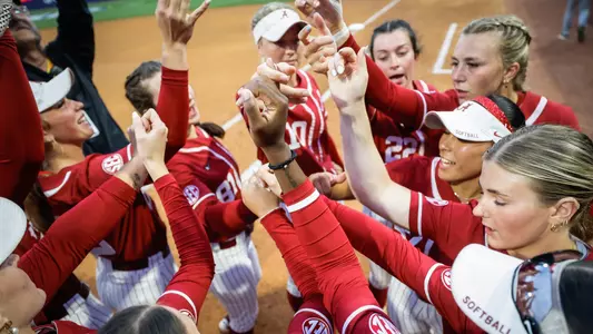 Alabama softball players huddle pregame vs. South Carolina at the SEC Tournament (May 7, 2025)