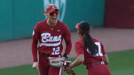 Audrey Vandagriff (12) celebrates with Salen Hawkins (47) vs. Oklahoma (April 13, 2025)
