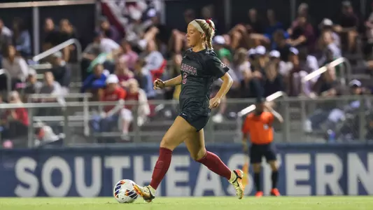 Kiley Kukan dribbles the soccer ball
