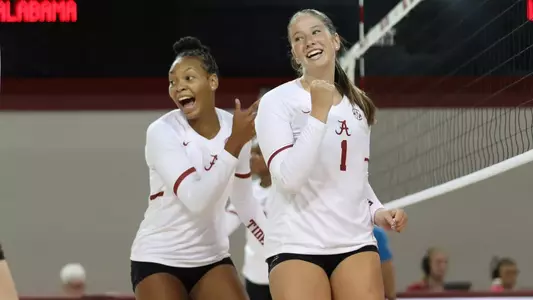 Sarah Stevens (7) and Hannah Parant (1) celebrate after a point vs. UNC Asheville (Aug. 29, 2025)