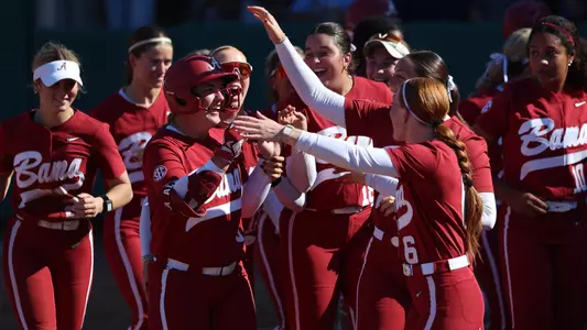 Ava Bush (9) celebrates with teammates after hitting a home run in fall ball (Oct. 11, 2026)