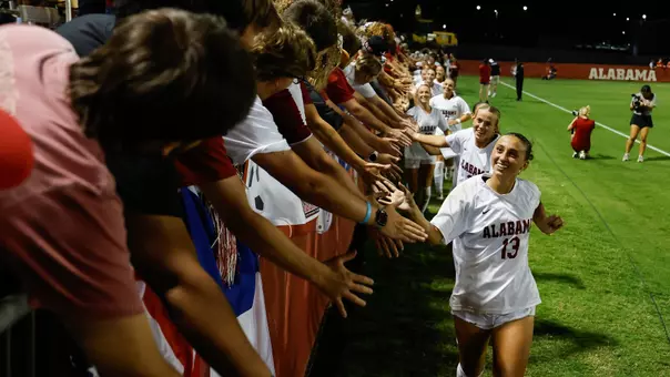 Alabama soccer players high five fans after a win over Ole Miss (Oct. 2, 2026)