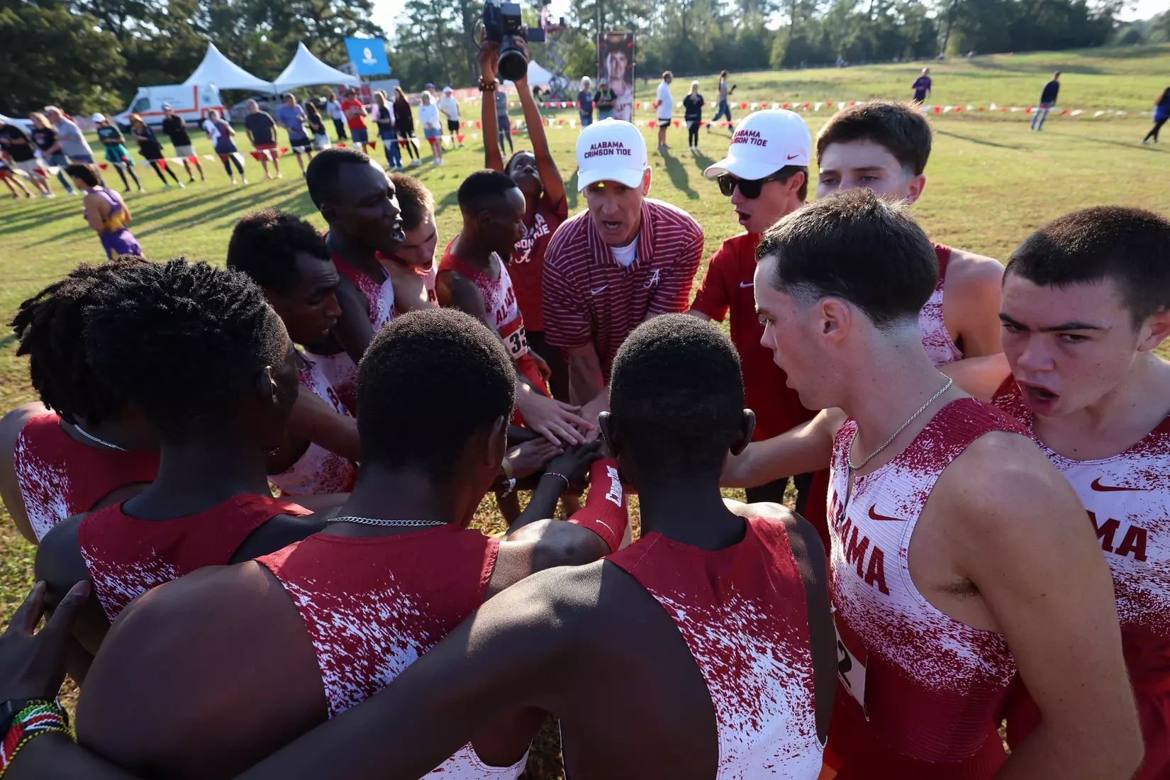 The University of Alabama Men's Track and Field Team huddles before the Crimson Classic at Harry Pritchett Running Park in Tuscaloosa, AL on Friday, Oct 16, 2026.