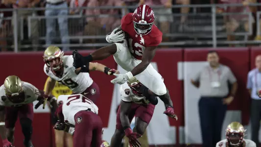 EJ Crowell jumping over defender