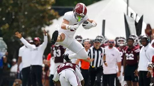 Marshall Pritchett jumping over defender