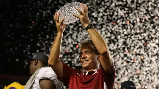 Nick Saban with BCS Trophy