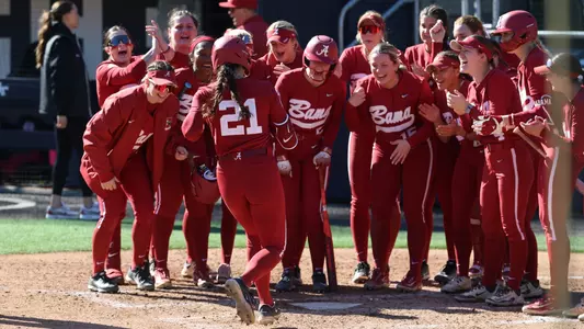 Alabama softball players await Ana Roman (21) at home plate to celebrate a home run vs. Villanova (Feb. 7, 2026)