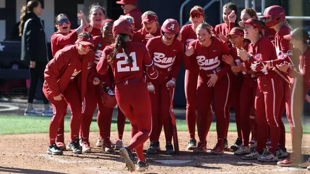Alabama softball players await Ana Roman (21) at home plate to celebrate a home run vs. Villanova (Feb. 7, 2026)
