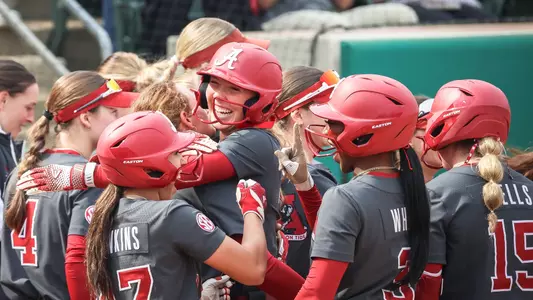 Audrey Vandagriff (12) celebrates with her teammates after a grand slam vs. Liberty