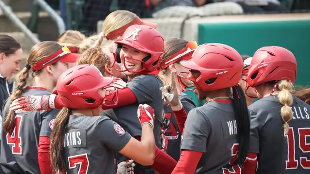 Audrey Vandagriff (12) celebrates with her teammates after a grand slam vs. Liberty