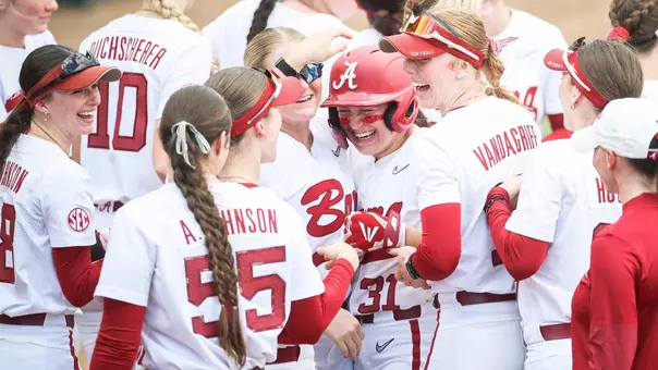 Alexis Pupillo (34) celebrates with teammates after a home run vs. Florida State (Feb. 21, 2026)