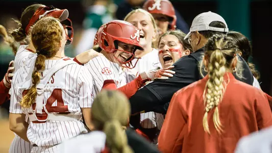 Lauren Johnson (88) hugging her teammates after hitting a game-ending double vs. USF (Feb. 27, 2026)