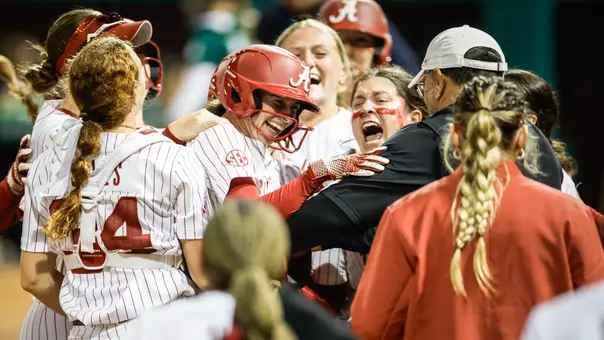Lauren Johnson (88) hugging her teammates after hitting a game-ending double vs. USF (Feb. 27, 2026)
