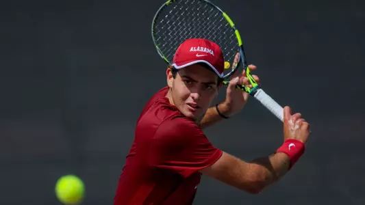 Carlos Gimenez Perez hits the ball