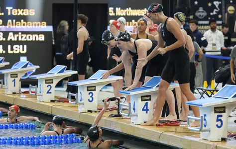 The 200 free relay team celebrates win