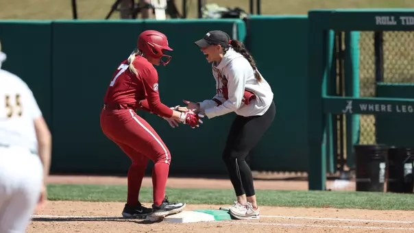 Holly Beth Brooks (7) and Kayla Braud celebrate at first after a base hit vs. NDSU (March 28, 2026)
