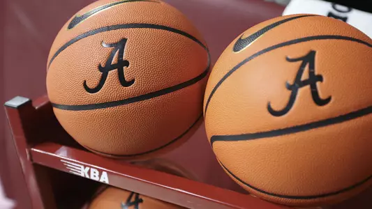 Basketballs sitting on a rack