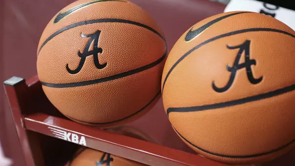 Basketballs sitting on a rack