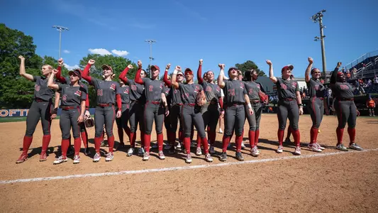 Alabama softball players celebrate on the field after a win over Auburn (April 12, 2026)
