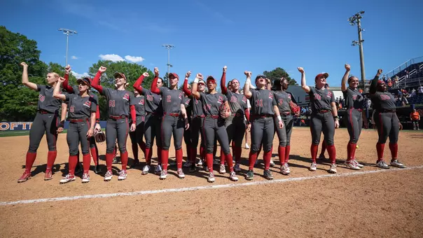 Alabama softball players celebrate on the field after a win over Auburn (April 12, 2026)