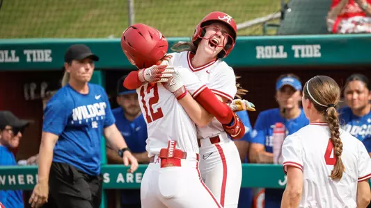 Audrey Vandagriff (12) and Gerritt Griggs (2) celebrate after a walk-off win vs. Kentucky (April 18, 2026)