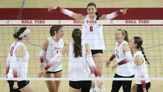 Alabama volleyball players celebrate during a spring match